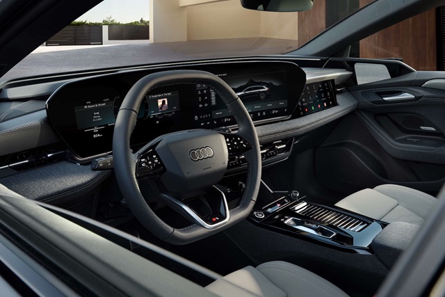 Innenraum des Audi A6 e-tron mit digitalem Cockpit, multifunktionalem Lenkrad und großem Touchscreen in der Mittelkonsole